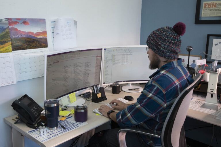 POBA Medical engineer works on his computer