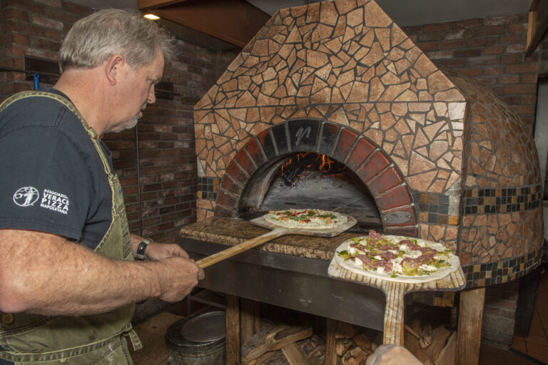 Cooking pizzas at Fat Olives