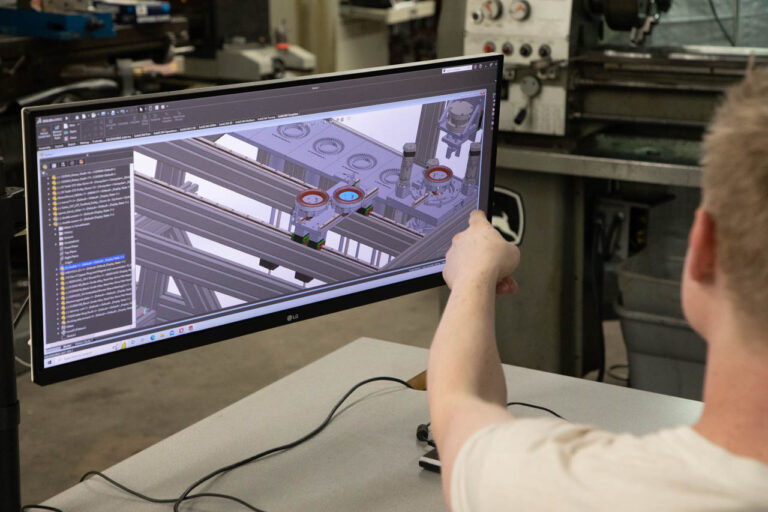 An Elemental Motors engineer reviews a CAD design