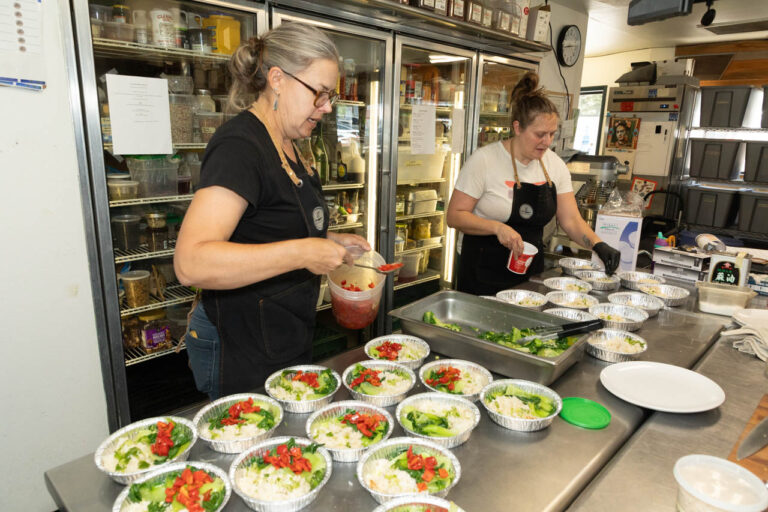 Laura Chamberlin & Elysse n prep kitchen.
