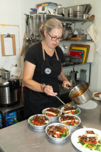 Laura Chamberlin adds sauce to eat-at-home meals.